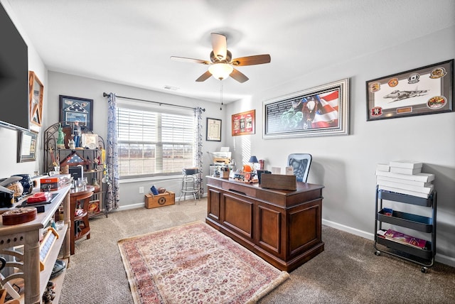 office space featuring ceiling fan and carpet