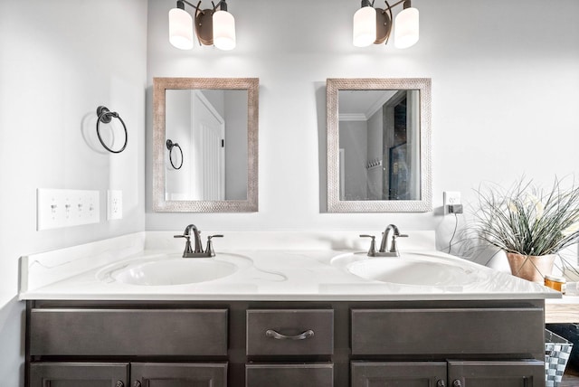 bathroom featuring crown molding and vanity