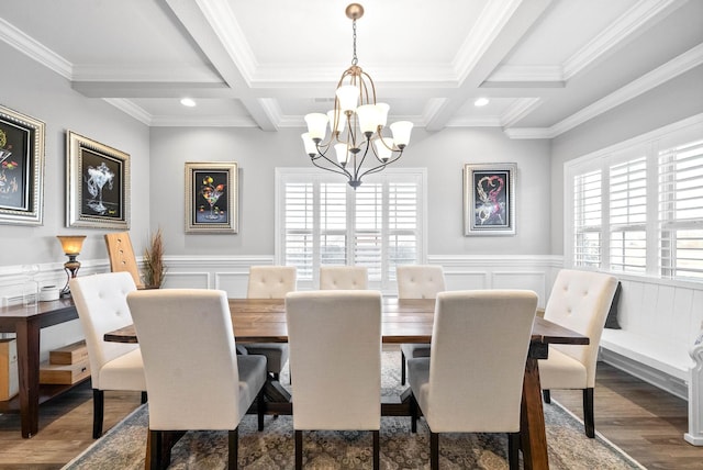 dining space with beamed ceiling, crown molding, and coffered ceiling