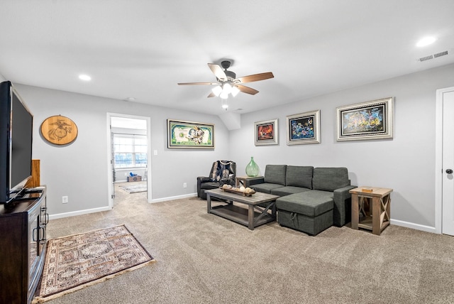 carpeted living room with ceiling fan