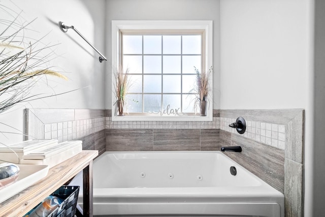 bathroom featuring a healthy amount of sunlight and a bathtub