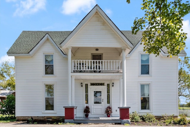 view of front facade featuring a balcony