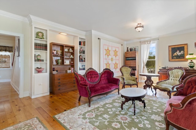 living room featuring crown molding and light wood-type flooring