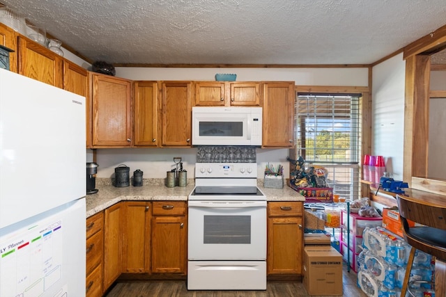 kitchen featuring a textured ceiling, crown molding, dark hardwood / wood-style floors, and white appliances