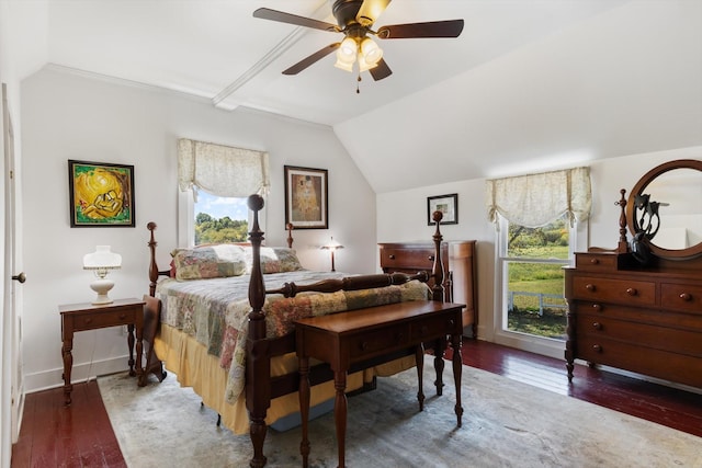 bedroom with dark hardwood / wood-style floors, vaulted ceiling, and ceiling fan