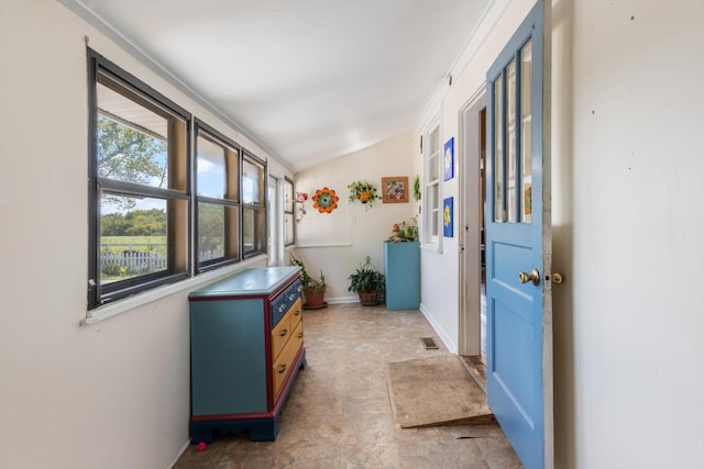 hallway featuring vaulted ceiling