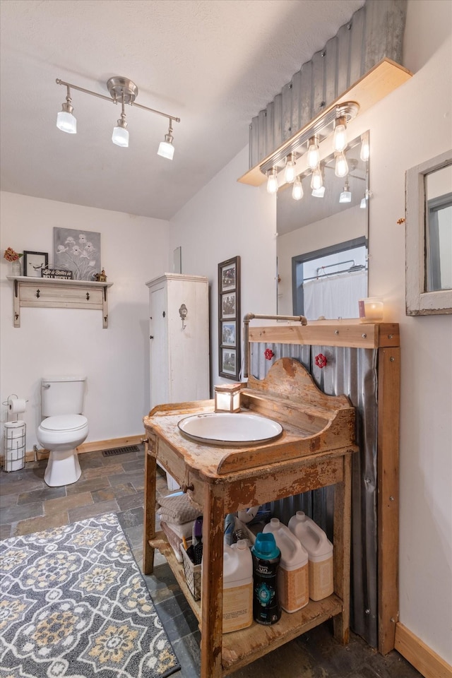 bathroom with sink and toilet