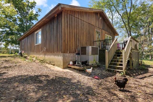 view of side of home with a deck