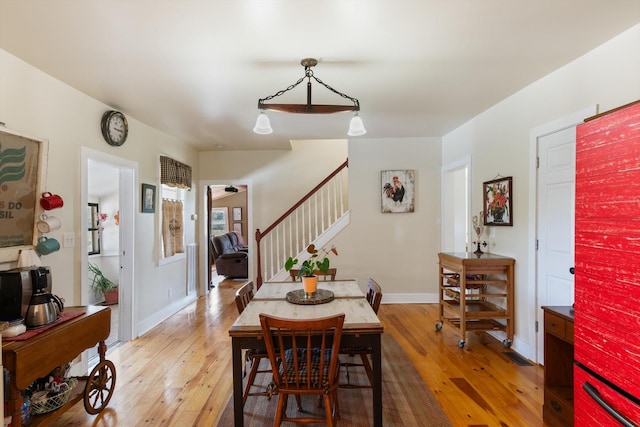 dining space featuring hardwood / wood-style floors