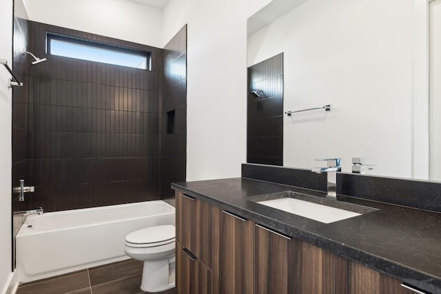 full bathroom with tiled shower / bath combo, toilet, and vanity