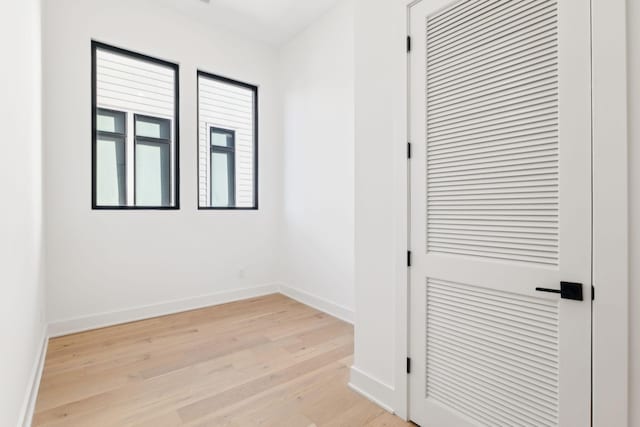 spare room with light wood-type flooring