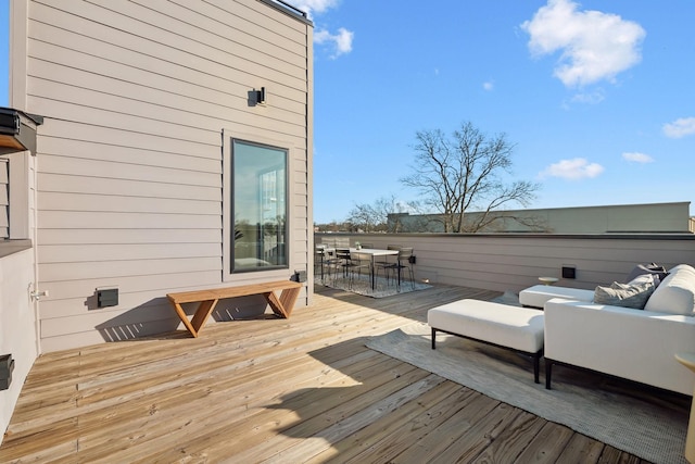 wooden terrace featuring an outdoor hangout area