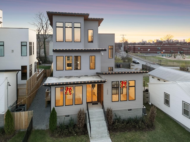 back house at dusk with central AC