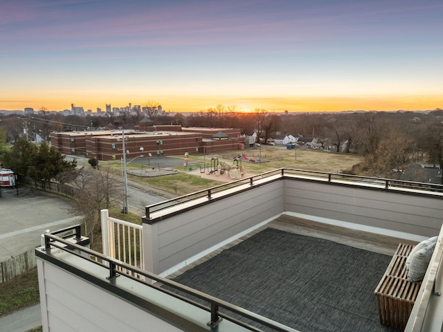 view of balcony at dusk