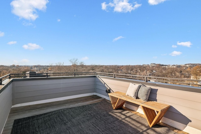 view of patio featuring a balcony