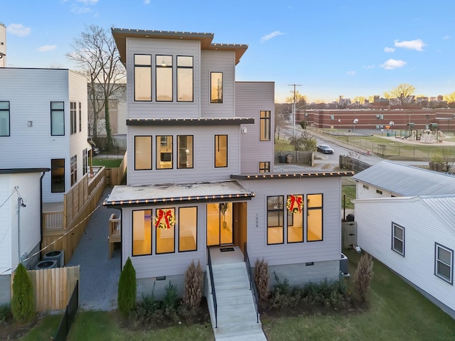 rear view of property featuring central AC