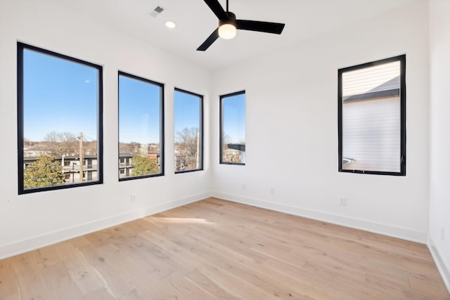 unfurnished room with light hardwood / wood-style floors and ceiling fan