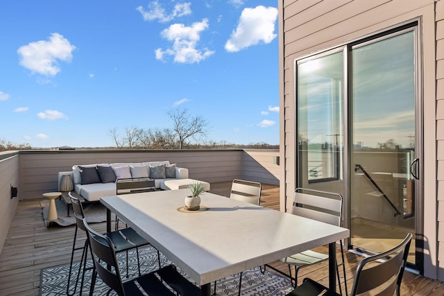 wooden deck featuring an outdoor hangout area