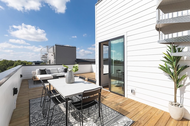 wooden deck featuring an outdoor hangout area