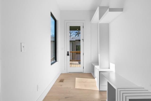 hallway with light wood-type flooring