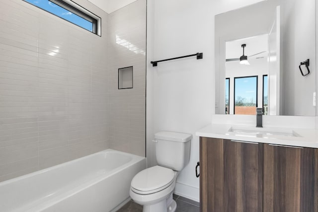 full bathroom with tub / shower combination, vanity, toilet, and a healthy amount of sunlight