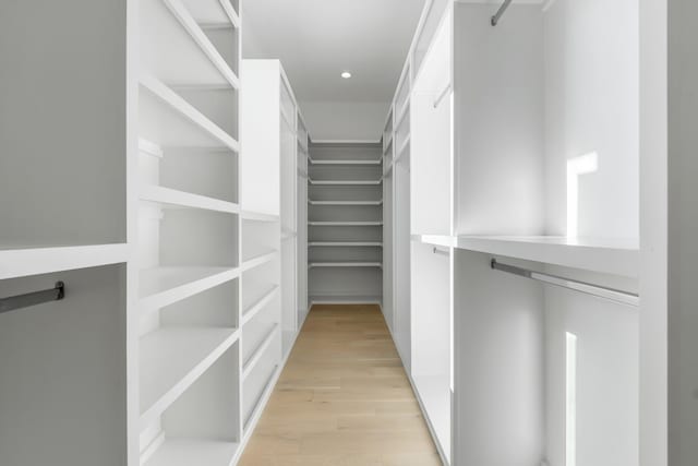 walk in closet featuring light hardwood / wood-style floors