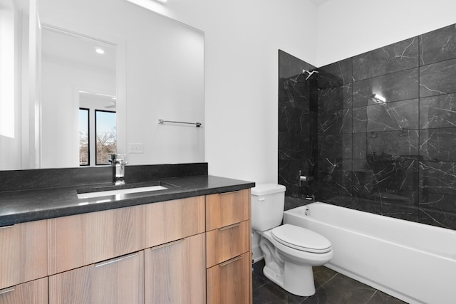 full bathroom with toilet, vanity, tiled shower / bath combo, and tile patterned floors