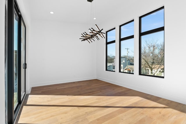 spare room with hardwood / wood-style flooring