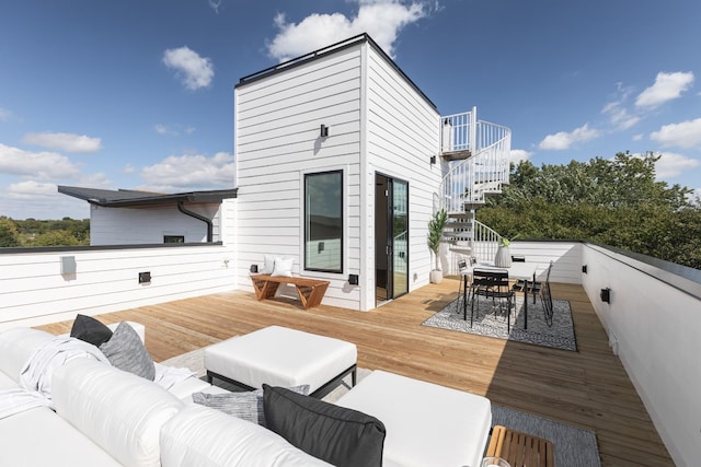 wooden terrace featuring an outdoor hangout area