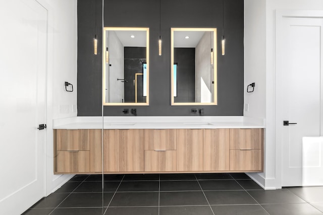 bathroom featuring tile patterned flooring and vanity