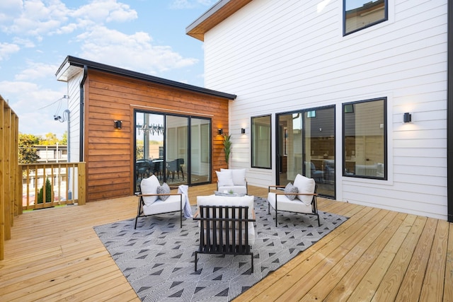 wooden deck with an outdoor hangout area