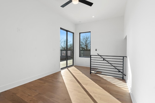 interior space featuring wood-type flooring and ceiling fan