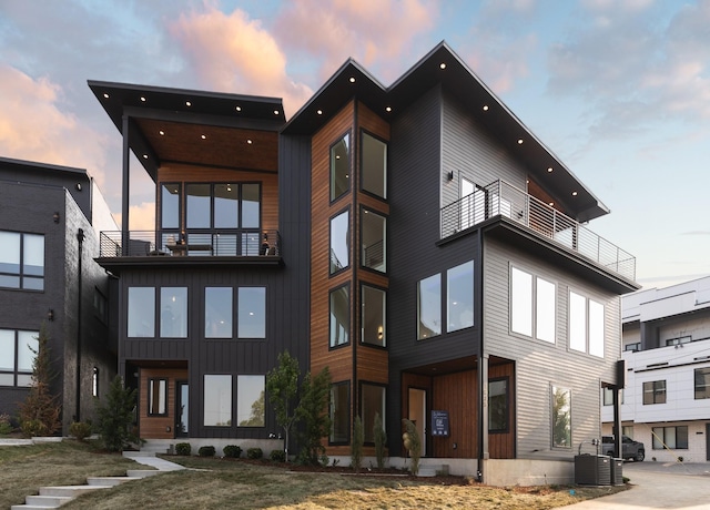 outdoor building at dusk featuring central AC