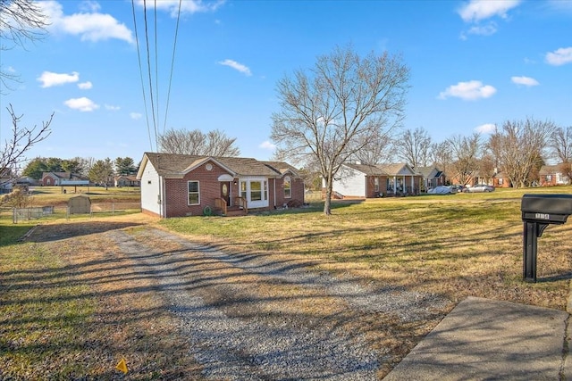 ranch-style house with a front yard