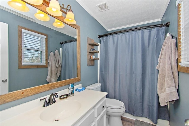 bathroom with walk in shower, a textured ceiling, toilet, vanity, and ornamental molding