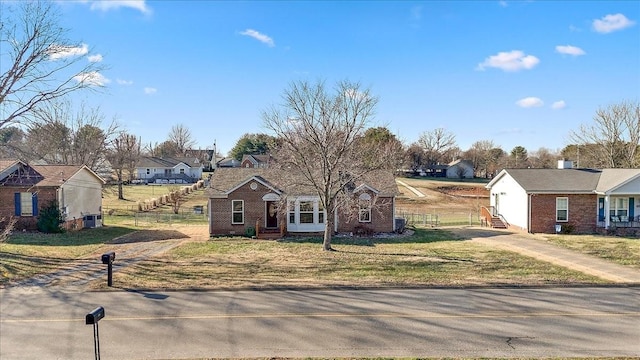 single story home with a front yard