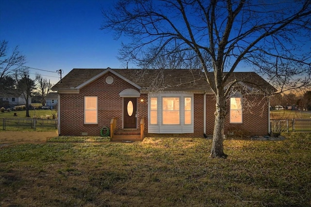 view of front of house with a yard