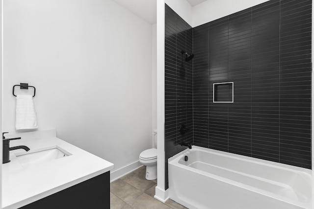 full bathroom with tile patterned floors, toilet, vanity, and tiled shower / bath combo