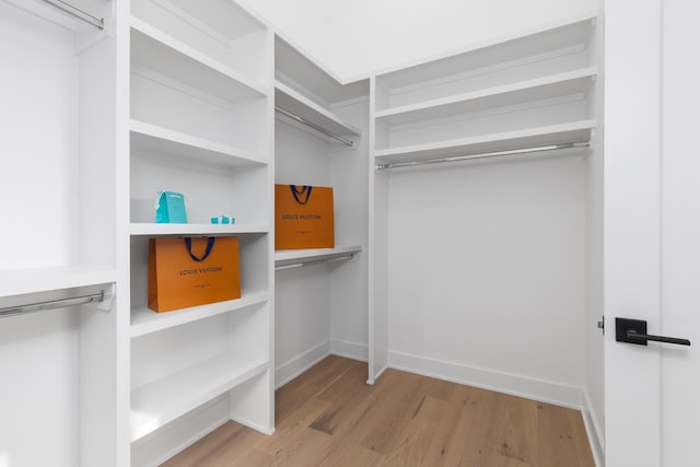 walk in closet featuring light hardwood / wood-style floors