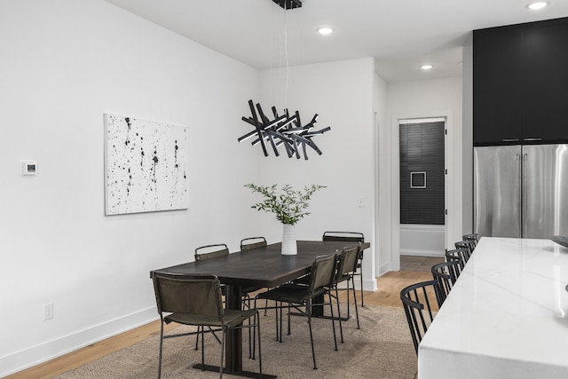 dining area featuring hardwood / wood-style floors