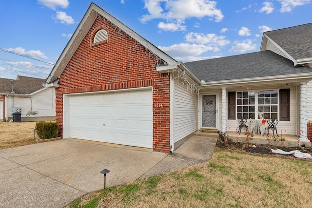 view of front of home with a front yard, a porch, and a garage