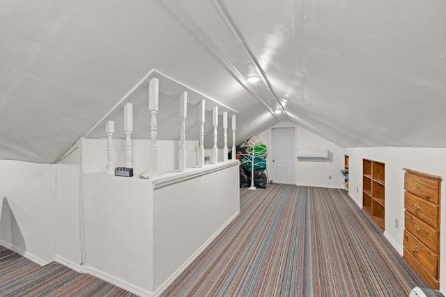 bonus room featuring carpet floors, a wall unit AC, and lofted ceiling