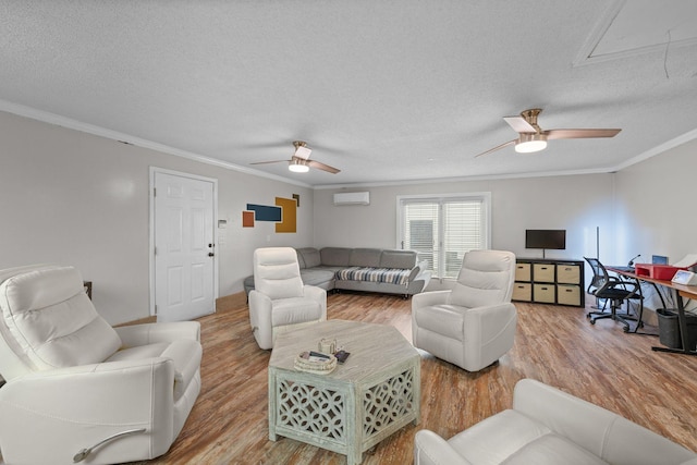 living room featuring hardwood / wood-style floors, a textured ceiling, a wall mounted AC, and crown molding