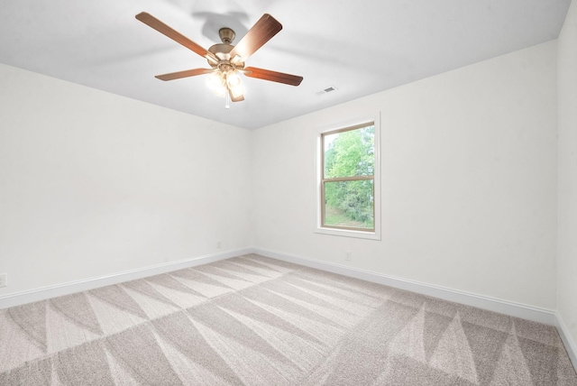 unfurnished room with light carpet and ceiling fan