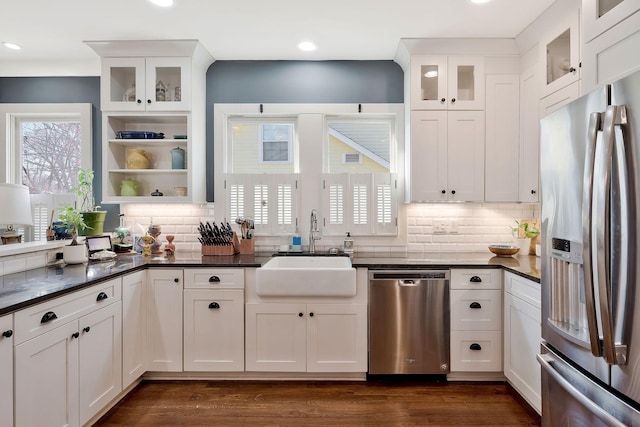 kitchen featuring sink, white cabinets, and appliances with stainless steel finishes