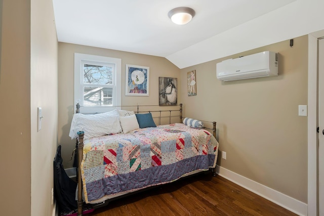 bedroom with dark hardwood / wood-style flooring, lofted ceiling, and an AC wall unit