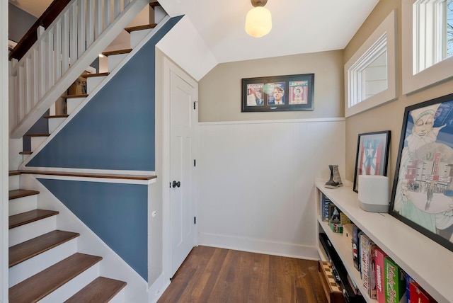 stairway with hardwood / wood-style flooring