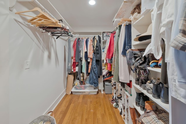 walk in closet featuring light hardwood / wood-style flooring