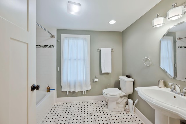 full bathroom featuring toilet, shower / bathtub combination, and sink