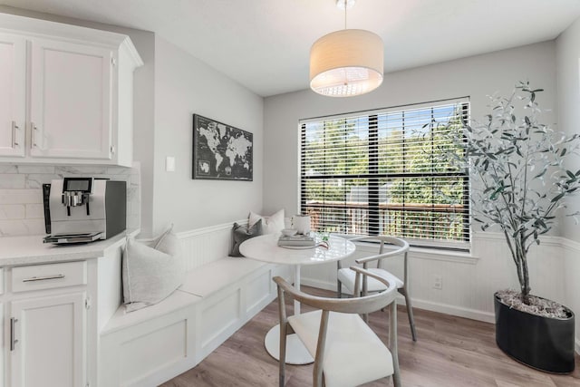 dining space featuring breakfast area and light hardwood / wood-style floors